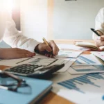Business owner reviewing finance options and coverage documents