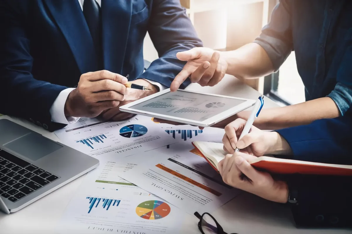 Business owners analyzing financial charts on a digital dashboard
