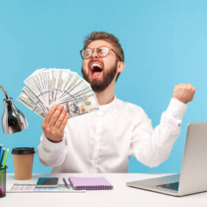 Person working on laptop with dollar signs and Money Makers